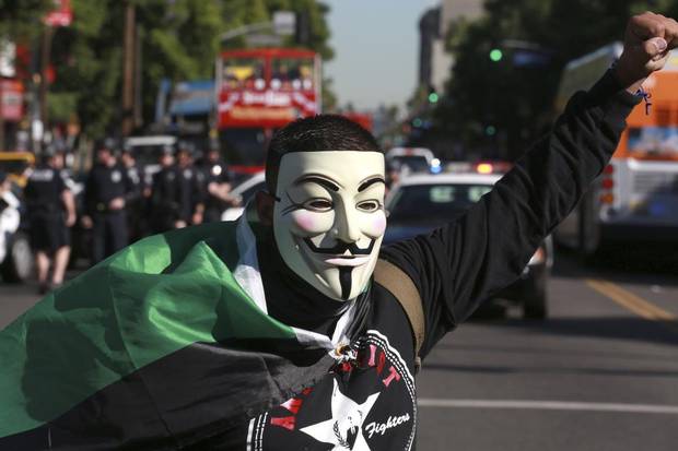 anonymous mask protest hollywod boulevard double decker bus